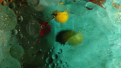 Chaotically moving multicolored bubbles in a viscous liquid substance. Stock-Footage 147266102
