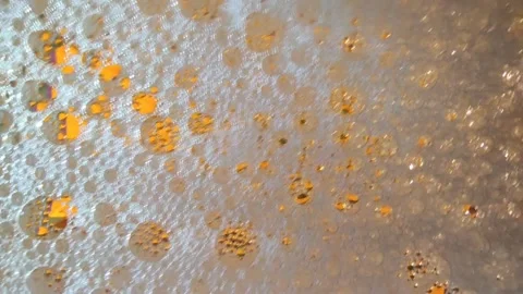 Chaotically moving multicolored foam bubbles on the surface of the liquid. Stock-Footage 147226869