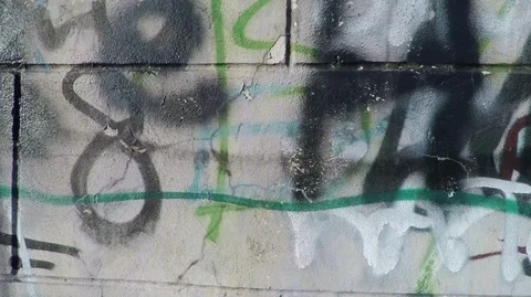 Chaotically painted wall of old building with walls, which sprinkled plaster and Stock Footage 124278474