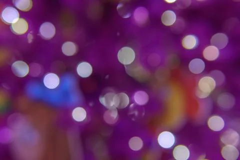 Chaotically placed bokeh circles shine with festive lights. Festive Christm. Stock Photos