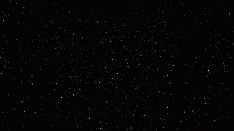 Chaotically swirling falling snowflakes on a dark background Stock Footage 256434800