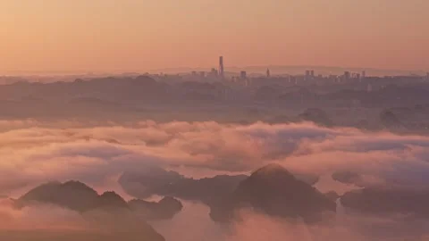 Chaoyang reflects the clouds and the distant city emerges. Stock Footage 311725137