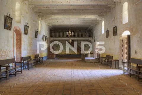 Chapel with adobe walls, tile floor, arched doors and windows Stock Photos