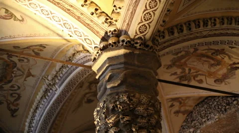 Chapel of Bones ceiling pillar, skeletons, skulls, church, tilt down, Portugal Stock Footage 59615298