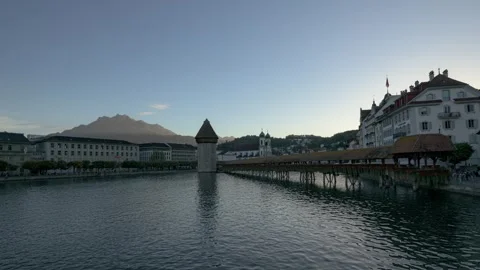 Chapel Bridge and Water Tower at dusk with Mount Pilatus in the background Stock Footage 328521404