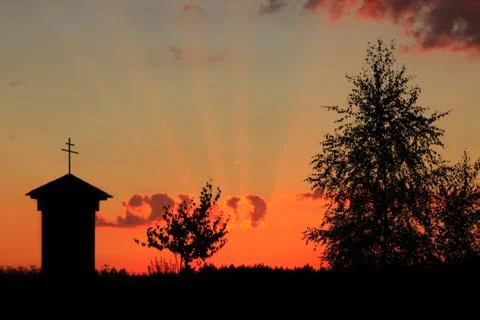 Chapel with a cross in the sunset Stock Photos