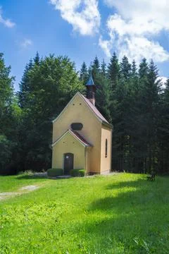 Chapel in a forest clearing Stock Photos