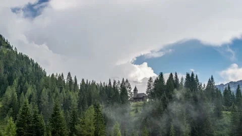 Chapel on a Mountain Ridge With Fast-Moving Clouds Stock Footage 146332680