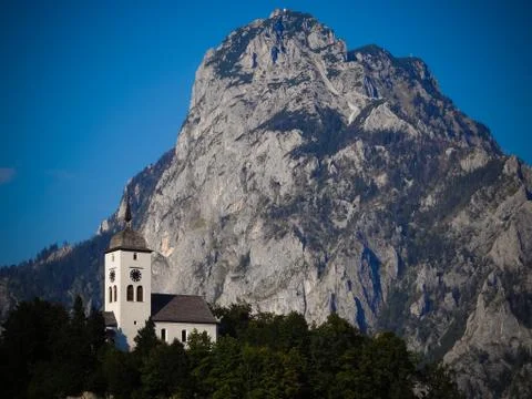 Chapel next to mountain Stock Photos