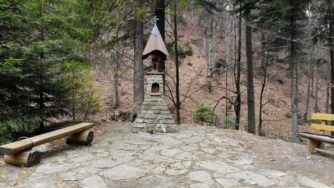 Chapel "Pod Kramarka" in early spring. Village Rytro, Poland. Stock Footage 127285358