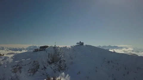 A chapel on the top of a mountain in winter Stockbeeldmateriaal 102559033