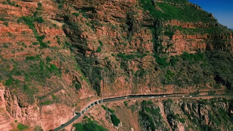 Chapman's Peak Drive winding road, close aerial above ocean Stock Footage 340554171