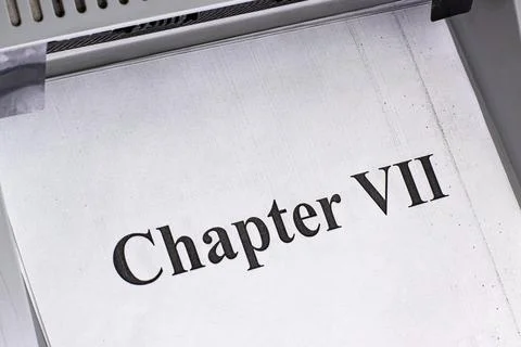 Chapter VII printed on a page from a document in a printing machine Foto stock