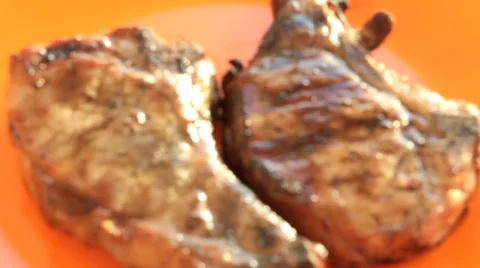Char grilled steak on a plate Stock Footage 50451451