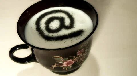 AT.character in a cup of milk. Stock Footage 8990504