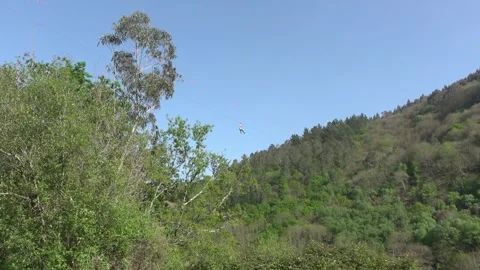 Character on a zipline seen from below - 47 Stock Footage 310049074