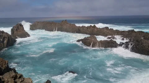 Charco del Viento, where the ocean’s waves crash onto volcanic rocks Stock Footage 307632333
