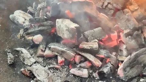 Charcoal burning with ash. Stockbeeldmateriaal 304311879