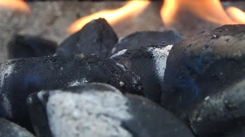 Charcoal burning on the bar b q waiting to cook some food Stock Footage 65747130
