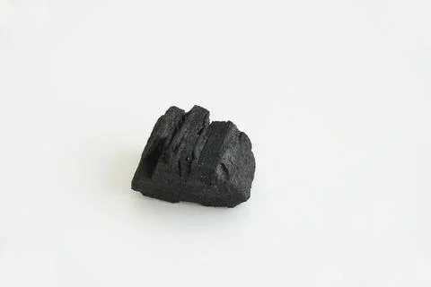 Charcoal is a carbon-rich solid residue produced by the wood combustion process. Stock Photos