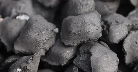 Charcoal compressed from crumbs is obtained under pressure and used to light a Stock Footage 324877802
