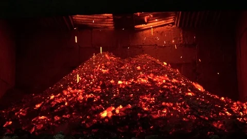 Charcoal from corncobs Falling from the stove. Stock Footage 70054777