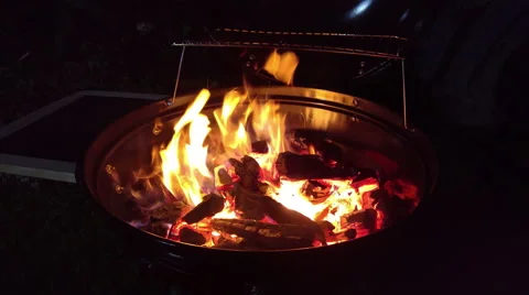 Charcoal on fire in a BBQ grill barbecue, 4K Stock Footage 66682811