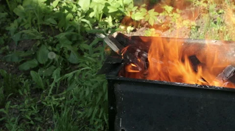 Charcoal on fire in a BBQ grill Stock Footage 63543500