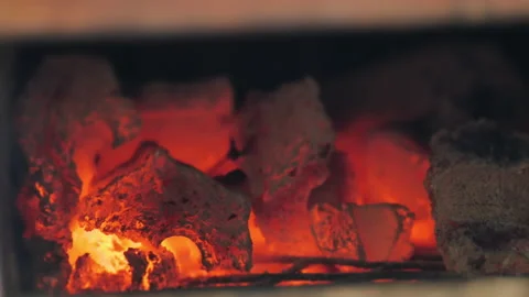 Charcoal flame burning in stove Stock Footage 154348384