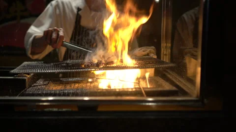Charcoal flame fire over grilling yakitori Japanese style chicken skewers t.. Stock Footage 258047157