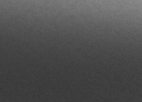 Charcoal gray paper background with a gradient matte texture and subtle grain Foto stock