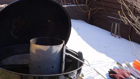 Charcoal ignites readying backyard grill for meat grilling. Witness as grill Stock Footage 271043965
