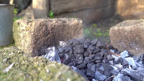 Charcoal ignition in rustic setting Stock Footage 287265247
