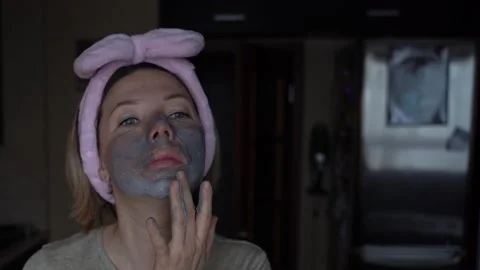 Charcoal mask on face Stock Footage 148882122