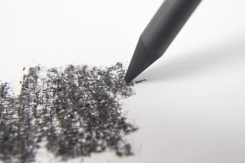 Charcoal or graphite sharp pen crayon strokes on white paper, soft focus cl.. Stock Photos