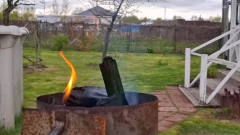 Charcoal starter to start a fire for outdoor barbecue.) Stock Footage 309811432