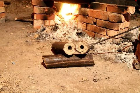 Charcoals, renewable solid fuel made from rice husk. cooking in a village p.. Stock Photos