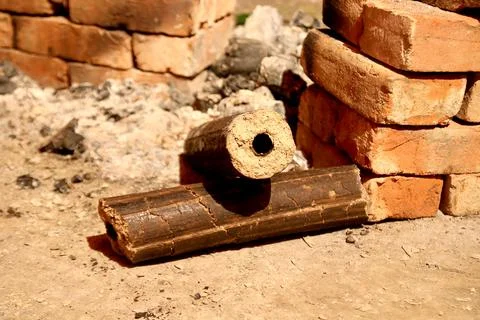 Charcoals, renewable solid fuel made from rice husk. cooking in a village p.. Stock Photos