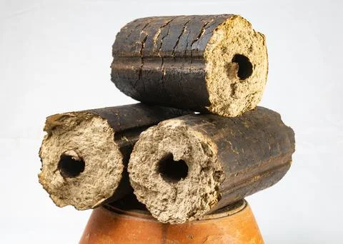 Charcoals, renewable solid fuel made from rice husk. cooking in a village p.. Stock-Fotos