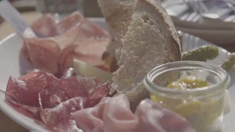 Charcuterie Plate with Bread and Pickles Served Outdoors in Sydney, Australia Stock Footage 345804780
