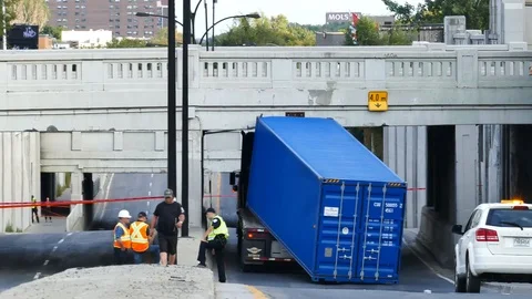 Charge of a truck fall after hitting a a bridge Stock-Footage 99842295