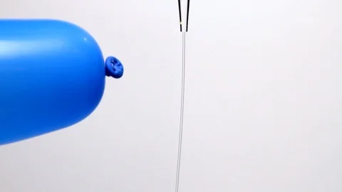 Charged balloon deflects water stream Video stock 86228816