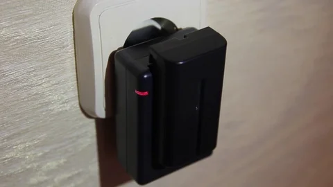 The charger charges the battery Stock Footage 73699952