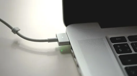 Charger connection to laptop Stock Footage 44389060