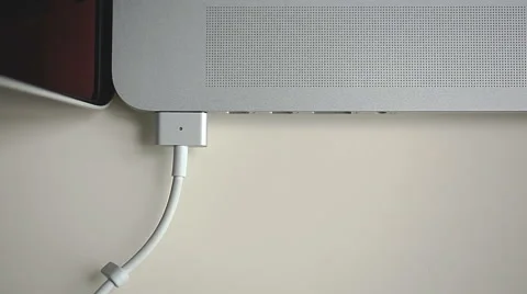 Charger connection to laptop Stock Footage 44389268