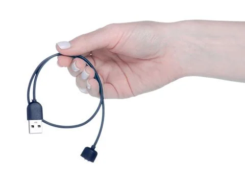 Charger for smart watch clock in hand Stock Photos
