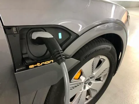 Charging an Audi e-tron SUV, the first electronic SUV by Audi Stock Photos