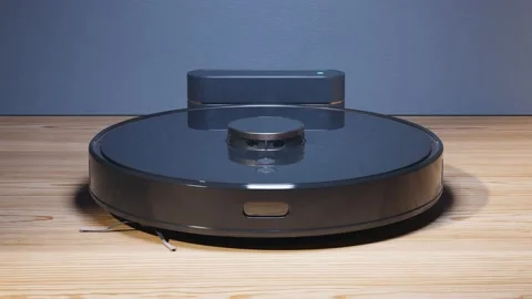 Charging the autonomous robotic vacuum cleaner. Ready for cleaning. Smart home. Video stock 201174461