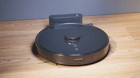 Charging the autonomous robotic vacuum cleaner. Ready for cleaning. Smart home. Video stock 201174552