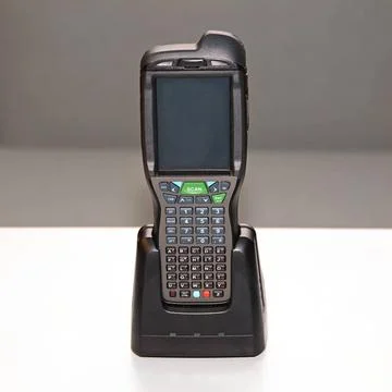 Charging Barcode Reader Handheld Laser Barcode Scanner Computer at Charger... Stock-Fotos